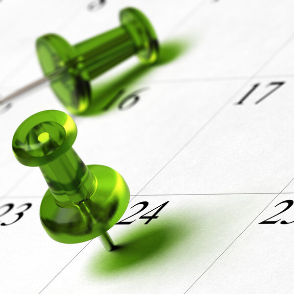 Foto: Ein Kalenderblatt mit den Daten 23 bis 26. Zwei grüne Reißzwecken sind auf den Tagen 24 und 25 platziert.